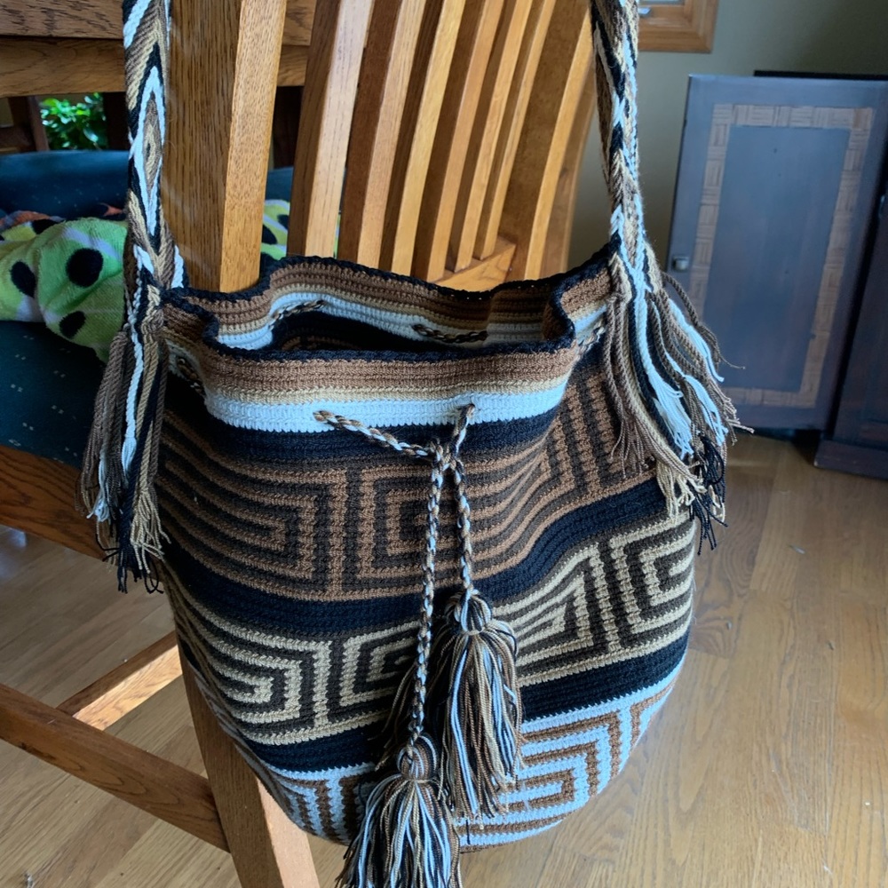Mexican made shoulder bag. Brown, cream and black with tassels. Wide 17” strap